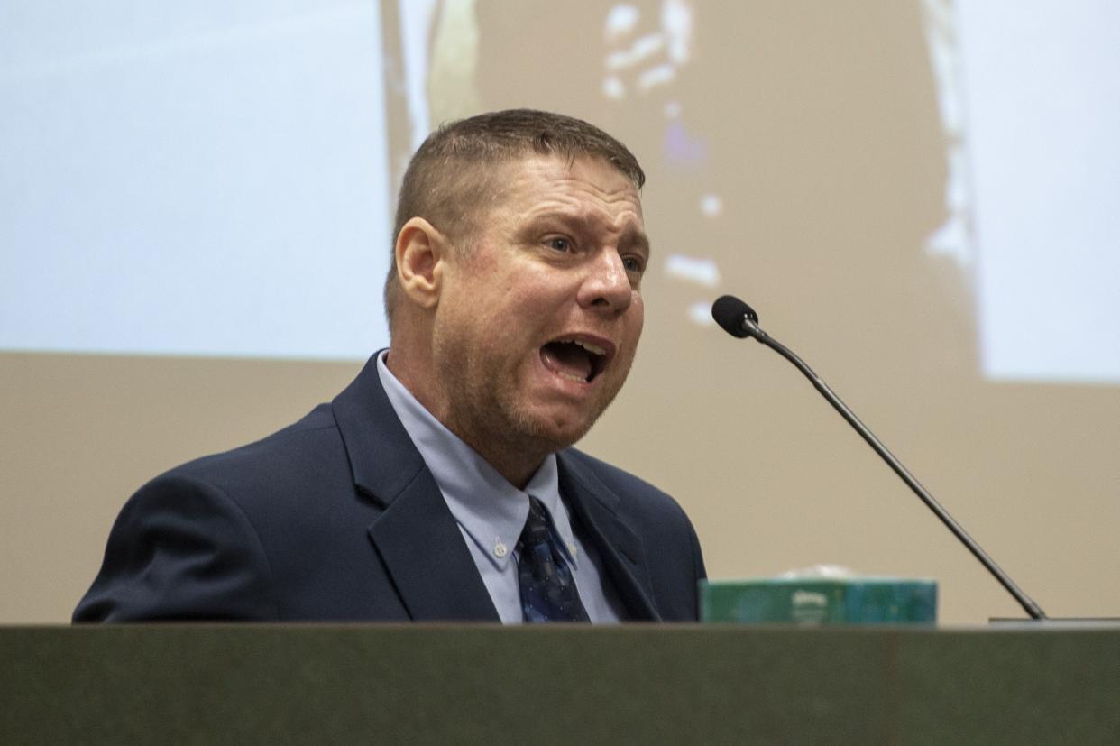 Jacob Blair Scott, who is accused of sexually assaulting a minor, cries out while being cross-examined by Assistant District Attorney Justin Lovorn, during his trial in Jackson County Circuit Court in Pascagoula, Miss., on  June 1, 2022