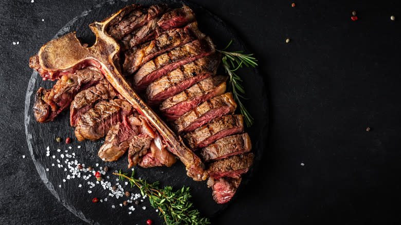 T-bone steak on stone dish