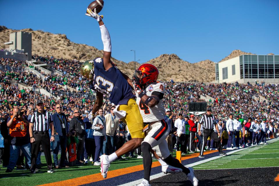 Notre Dame wide receiver Jayden Thomas (83) fails to catch a touchdown pass as he's defended by Oregon State defensive back Jaden Robinson (4) during the first half of the Sun Bowl NCAA college football game, Friday, Dec. 29, 2023, in El Paso, Texas. (AP Photo/Andres Leighton)