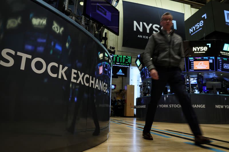 Traders work on the floor of the NYSE in New York