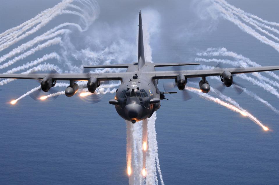US Air Force AC-130H Spectre gunship jettisons flares