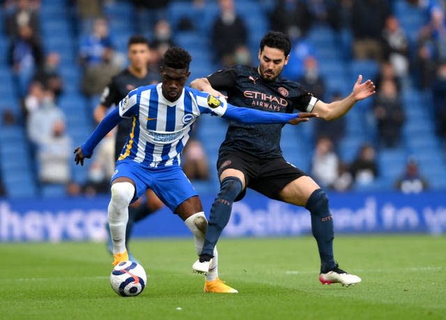 Gundogan (right) suffered a knee injury in last week's defeat at Brighton