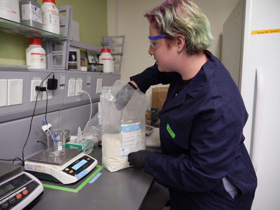 The Living Materials Laboratory at the University of Colorado Boulder utilizes calcifying microalgae, which produce limestone, to create a carbon neutral cement, as well as cement products which can slowly pull carbon dioxide out of the atmosphere and store it. Rebecca Mikofsky, CU Boulder material science PhD student, starts with powder limestone to create biogenic limestone produced by calcifying microalgae, known as coccolithophores.  / Credit: Photo by Glenn Asakawa/University of Colorado