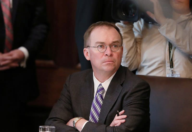 FILE PHOTO: Acting White House Chief of Staff Mulvaney listens during Trump cabinet meeting at the White House in Washington