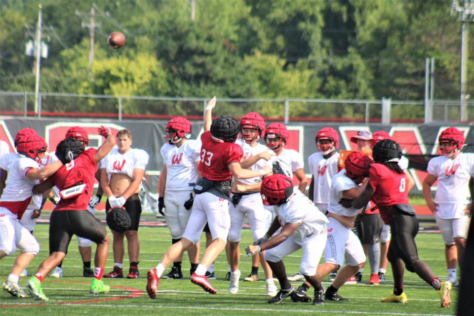 A Firebird QB throws a pass. Lakota West High School football practice, August 2, 2023. (Syndication: The Enquirer)