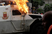 <p>An armored police vehicle is seen on fire during rally against Venezuela’s President Nicolas Maduro in Caracas, Venezuela May 3, 2017. (Marco Bello/Reuters) </p>