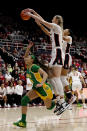 Stanford forward Cameron Brink, front right, blocks a shot by Oregon guard Endyia Rogers, left, during the first half of an NCAA college basketball game Sunday, Jan. 29, 2023, in Stanford, Calif. (AP Photo/Josie Lepe)