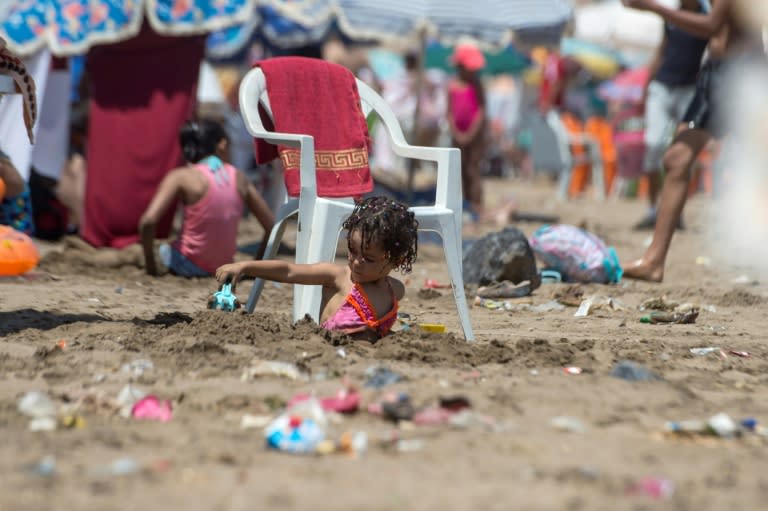 A child plays on the beach in Rabat on July 12, 2018