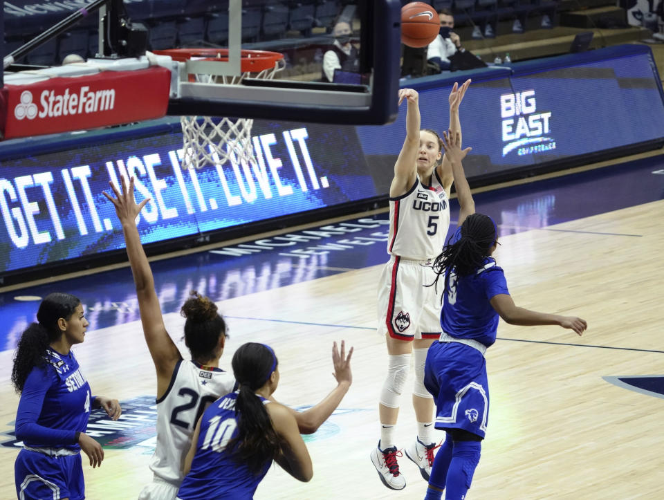 Connecticut guard Paige Bueckers (5) shoots against Seton Hall during the second half of an NCAA college basketball game Wednesday, Feb. 10, 2021, in Storrs, Conn. (David Butler II/Pool Photo via AP)