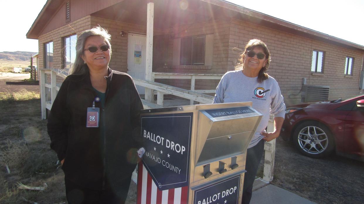 A ballot dropbox in Kykotsmovi on the Hopi Nation with translator Maxine Wadsworth (left) and Hopi Elections Registrar Karen Shupla.