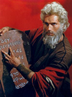 Charlton Heston as Moses holding one of the two tablets containing "The Ten Commandments" in Cecil B. DeMille's 1956 classic film. Paramount Pictures (courtesy)