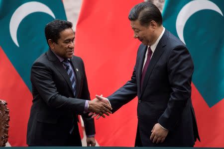 FILE PHOTO: Maldives President Abdulla Yameen shakes the hand of China's President Xi Jinping after a signing meeting at the Great Hall of the People in Beijing, China December 7, 2017. REUTERS/Fred Dufour/Pool/File Photo