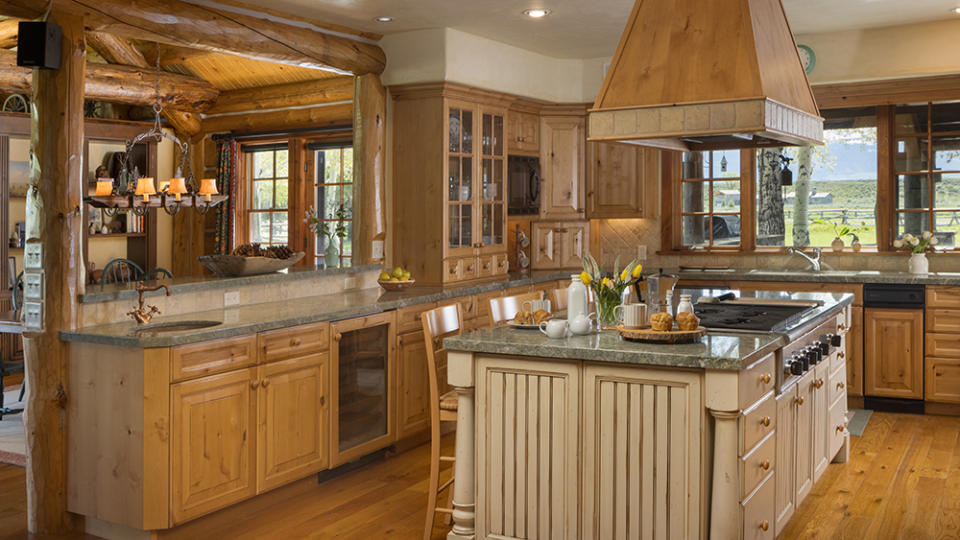 The main kitchen features a stunning island. - Credit: Aaron Kraft/Krafty Photos