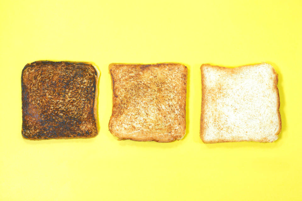 Badly burnt, rightly toasted and plain bread slice on yellow background.