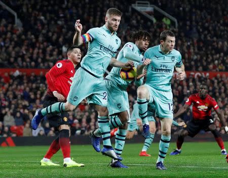 Soccer Football - Premier League - Manchester United v Arsenal - Old Trafford, Manchester, Britain - December 5, 2018 Arsenal's Shkodran Mustafi, Alex Iwobi and Stephan Lichtsteiner in action REUTERS/Darren Staples