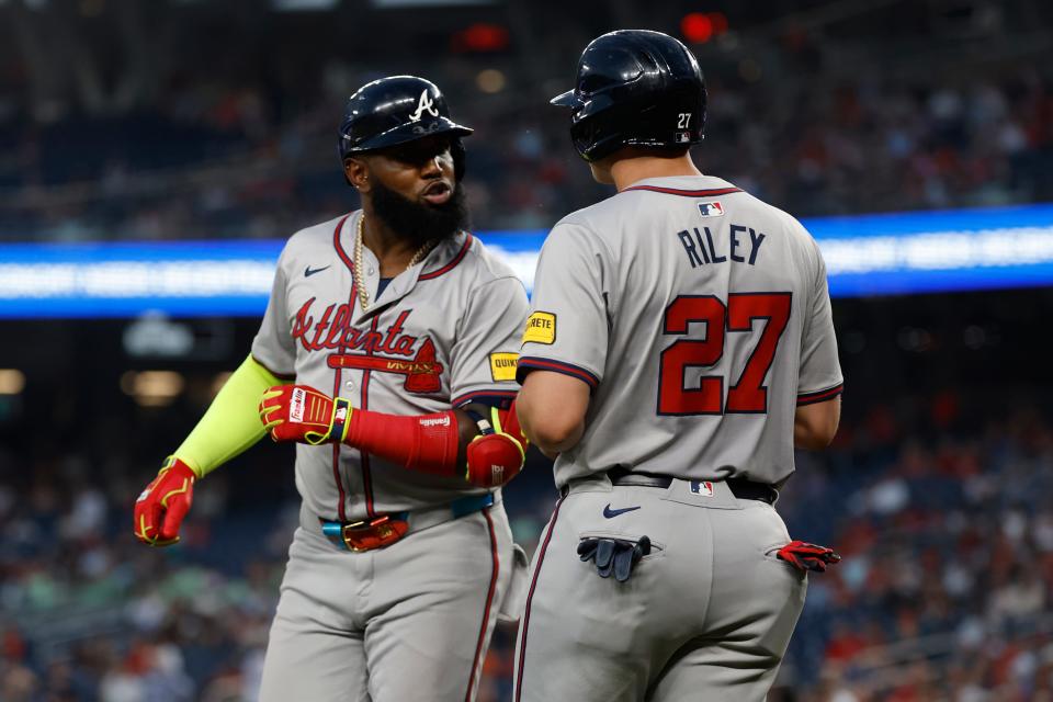 Marcell Ozuna and Austin Riley during a game against the Nationals.