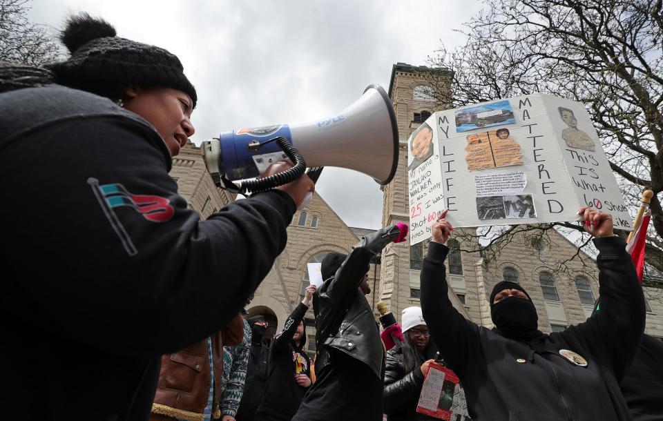 Protesters make their voices heard after the grand jury's decision not to criminally charge the eight Akron police officers who shot and killed Jayland Walker last summer as they march from First Congregational Church of Akron to the John F. Seiberling Federal Building, Tuesday, April 18, 2023.