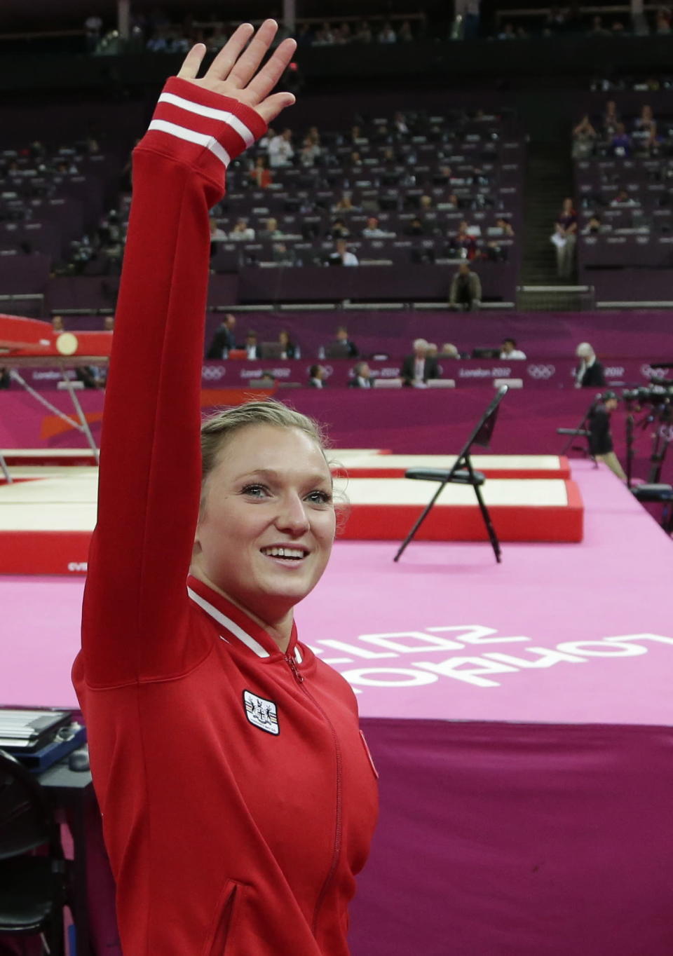 Canada's gold medallist Rosannagh Maclennan waves to the audience during the qualifying round of the women's trampoline at the 2012 Summer Olympics, Saturday, Aug. 4, 2012, in London. (AP Photo/Gregory Bull)