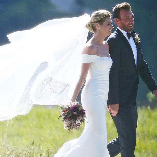 <p>Sports commentator and <em>Dancing with the Stars</em> co-host Erin Andrews wed hockey player Jarret Stoll in Montana in late June in a sunset ceremony designed by Yifat Oren. The bride wore a custom gown by Carolina Herrera for the outdoor affair, and expressed her gratitude for their hard work on her custom gown on Instagram after the couple's northwest nuptials.</p>