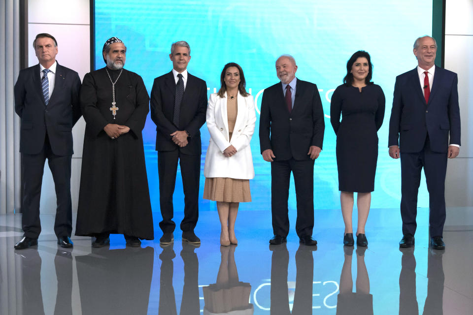 FILE - Brazil's President Jair Bolsonaro, from left, who is running for reelection, Padre Kelmon of the Brazilian Labour Party, Felipe D'Avila of the Novo Party, Soraya Thronicke of the Brasil Union Party, former president and now presidential candidate Luiz Inacio "Lula" da Silva of the Workers' Party, Simone Tebet of the Brazilian Democratic Movement Party, and Ciro Gomes of the Democratic Labour Party, pose at a presidential debate in Rio de Janeiro, Brazil, Sept. 29, 2022. Despite the smoke clogging the air of entire Amazon cities, state elections have largely ignored environmental issues. (AP Photo/Bruna Prado, File)