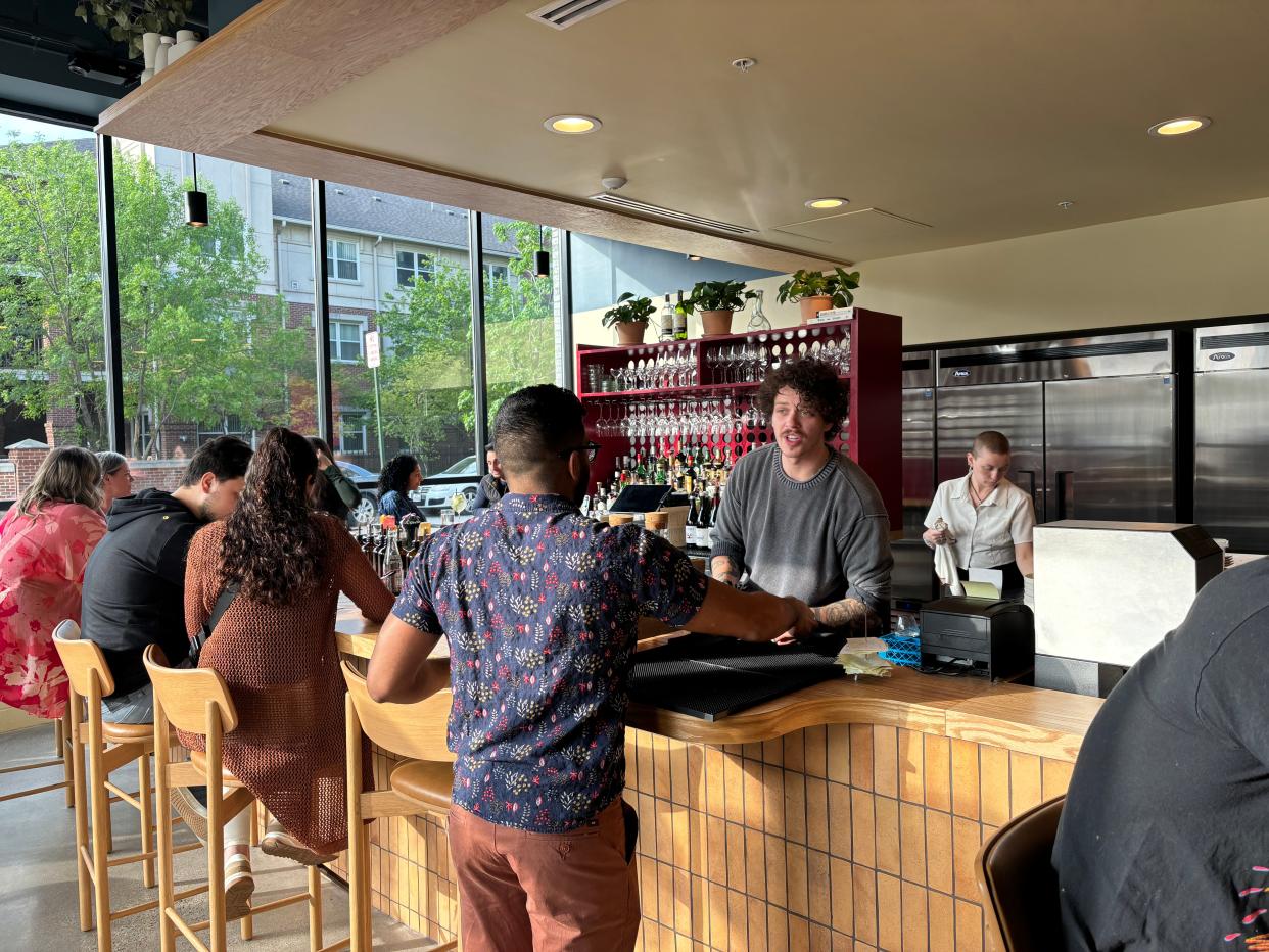 Leña, a new eatery in Brush Park, features a bar and lounge area next to its open kitchen.