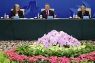 Australia's former Trade Minister Craig Emerson, center, speaks next to China's former Foreign Minister Li Zhaoxing, right, and Australia's Department of Foreign Affairs and Trade Secretary Jan Adams at the 7th China-Australia High Level Dialogue at the Diaoyutai State Guesthouse in Beijing Thursday, Sept. 7, 2023. (Florence Lo/Pool Photo via AP)