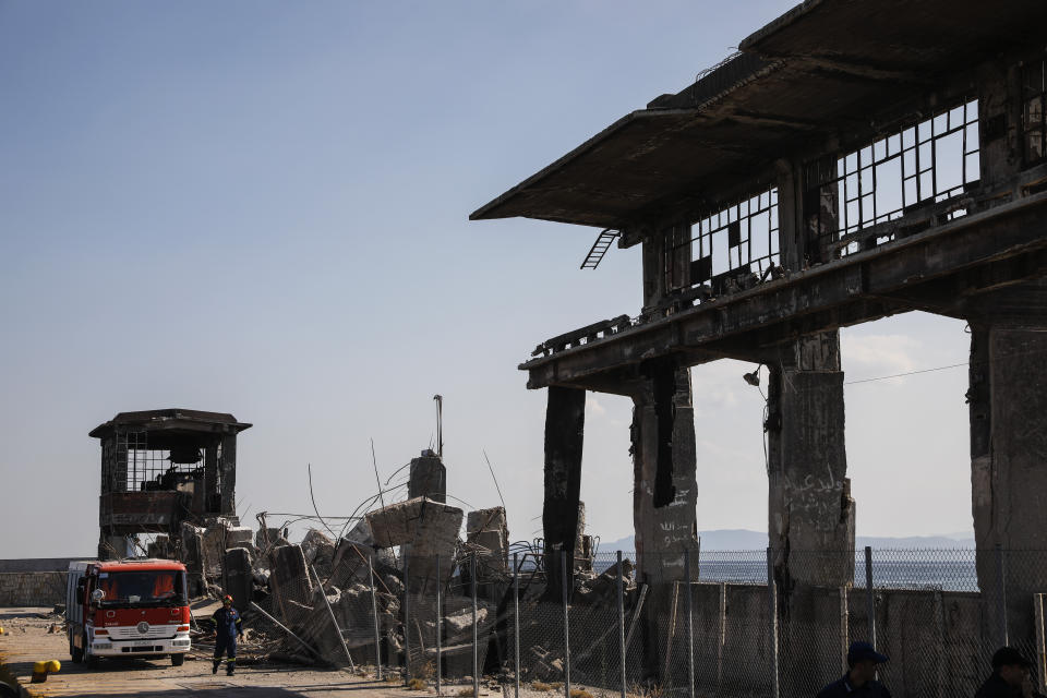 Firefighters search for trapped people at a damaged structure following an earthquake at the port of Piraeus, near Athens, on Friday, July 19, 2019. The Athens Institute of Geodynamics gave the earthquake a preliminary magnitude of 5.1 but the U.S. Geological Survey gave it a preliminary magnitude of 5.3. The Athens Institute says the quake struck at 2:38 p.m. local time (1113 GMT) about 26 kilometers (13.7 miles) north of Athens. (AP Photo/Petros Giannakouris)