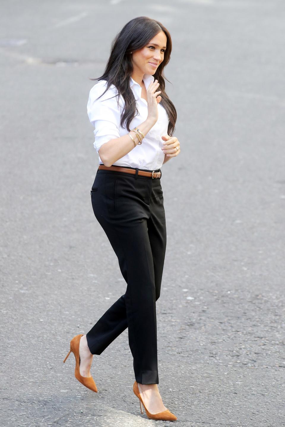 Meghan Markle <a href="https://people.com/royals/meghan-markle-launches-smart-works-capsule-collection/" rel="nofollow noopener" target="_blank" data-ylk="slk:stepped out for her first official royal engagement;elm:context_link;itc:0;sec:content-canvas" class="link ">stepped out for her first official royal engagement</a> since the birth of her son, Archie, modeling her new Smart Works capsule collection in London. Meghan accessorized her white Misha Nonoo button-down shirt and black Jigsaw trousers (both part of her collection) with a cognac-colored belt and matching pumps. <strong>Get the Look!</strong> J.Crew Slim Stretch Perfect Shirt, $48.65 (orig. $69.95); <a href="https://click.linksynergy.com/deeplink?id=93xLBvPhAeE&mid=1237&murl=https%3A%2F%2Fshop.nordstrom.com%2Fs%2Fj-crew-slim-stretch-perfect-shirt-regular-petite%2F5041421&u1=PEO%2CShopping%3AEverythingYouNeedtoCopyMeghanMarkle%27sChicSummerStyle%2Ckamiphillips2%2CUnc%2CGal%2C6939680%2C201909%2CI" rel="nofollow noopener" target="_blank" data-ylk="slk:nordstrom.com;elm:context_link;itc:0;sec:content-canvas" class="link ">nordstrom.com</a> Everlane The Silky Cotton Relaxed Shirt, $50; <a href="https://www.pjtra.com/t/8-9711-131940-104709?sid=PEO%2CShopping%3AEverythingYouNeedtoCopyMeghanMarkle%27sChicSummerStyle%2Ckamiphillips2%2CUnc%2CGal%2C6939680%2C201909%2CI&url=https%3A%2F%2Fwww.everlane.com%2Fproducts%2Fwomens-silky-cttn-relaxed-shirt-offwhite%3Fcollection%3Dwomens-tops" rel="nofollow noopener" target="_blank" data-ylk="slk:everlane.com;elm:context_link;itc:0;sec:content-canvas" class="link ">everlane.com</a> Madewell Drapey Oversized Boyshirt, $65; <a href="https://click.linksynergy.com/deeplink?id=93xLBvPhAeE&mid=42352&murl=https%3A%2F%2Fwww.shopbop.com%2Fdrapey-oversized-boyshirt-madewell%2Fvp%2Fv%3D1%2F1566627507.htm&u1=PEO%2CShopping%3AEverythingYouNeedtoCopyMeghanMarkle%27sChicSummerStyle%2Ckamiphillips2%2CUnc%2CGal%2C6939680%2C201909%2CI" rel="nofollow noopener" target="_blank" data-ylk="slk:shopbop.com;elm:context_link;itc:0;sec:content-canvas" class="link ">shopbop.com</a> & Other Stories Tapered Pants, $69; <a href="https://click.linksynergy.com/deeplink?id=93xLBvPhAeE&mid=41994&murl=https%3A%2F%2Fwww.stories.com%2Fen_usd%2Fclothing%2Ftrousers%2Ftailored%2Fproduct.tapered-cotton-pants-black.0277818001.html&u1=PEO%2CShopping%3AEverythingYouNeedtoCopyMeghanMarkle%27sChicSummerStyle%2Ckamiphillips2%2CUnc%2CGal%2C6939680%2C201909%2CI" rel="nofollow noopener" target="_blank" data-ylk="slk:stories.com;elm:context_link;itc:0;sec:content-canvas" class="link ">stories.com</a> Halogen Slim Straight Trousers, $79; <a href="https://click.linksynergy.com/deeplink?id=93xLBvPhAeE&mid=1237&murl=https%3A%2F%2Fshop.nordstrom.com%2Fs%2Fhalogen-slim-straight-trousers-regular-petite%2F5204783&u1=PEO%2CShopping%3AEverythingYouNeedtoCopyMeghanMarkle%27sChicSummerStyle%2Ckamiphillips2%2CUnc%2CGal%2C6939680%2C201909%2CI" rel="nofollow noopener" target="_blank" data-ylk="slk:nordstrom.com;elm:context_link;itc:0;sec:content-canvas" class="link ">nordstrom.com</a> Vince Tapered Trousers, $295; <a href="https://click.linksynergy.com/deeplink?id=93xLBvPhAeE&mid=42352&murl=https%3A%2F%2Fwww.shopbop.com%2Ftapered-trousers-vince%2Fvp%2Fv%3D1%2F1547378287.htm&u1=PEO%2CShopping%3AEverythingYouNeedtoCopyMeghanMarkle%27sChicSummerStyle%2Ckamiphillips2%2CUnc%2CGal%2C6939680%2C201909%2CI" rel="nofollow noopener" target="_blank" data-ylk="slk:shopbop.com;elm:context_link;itc:0;sec:content-canvas" class="link ">shopbop.com</a> Simmi London Imani Mocha Patent Pumps, $48; <a href="https://www.asos.com/us/simmi-shoes/simmi-london-imani-mocha-patent-pumps/prd/10660149" rel="nofollow noopener" target="_blank" data-ylk="slk:asos.com;elm:context_link;itc:0;sec:content-canvas" class="link ">asos.com</a> Calvin Klein Brady Pumps, $41.33 - $160.32; <a href="https://www.amazon.com/Calvin-Klein-Womens-Platform-Caramel/dp/B00X699D50/ref=as_li_ss_tl?keywords=cognac+suede+women+pumps&qid=1568300302&sr=8-2&linkCode=ll1&tag=poamzfmeghanmarklesummerstylekphillips0919-20&linkId=8cc52527838503bcb6193f783a31841f&language=en_US" rel="nofollow noopener" target="_blank" data-ylk="slk:amazon.com;elm:context_link;itc:0;sec:content-canvas" class="link ">amazon.com</a> Stuart Weitzman Anny Pointy Toe Pump, $398; <a href="https://click.linksynergy.com/deeplink?id=93xLBvPhAeE&mid=1237&murl=https%3A%2F%2Fshop.nordstrom.com%2Fs%2Fstuart-weitzman-anny-pointy-toe-pump-women%2F5064761&u1=PEO%2CShopping%3AEverythingYouNeedtoCopyMeghanMarkle%27sChicSummerStyle%2Ckamiphillips2%2CUnc%2CGal%2C6939680%2C201909%2CI" rel="nofollow noopener" target="_blank" data-ylk="slk:nordstrom.com;elm:context_link;itc:0;sec:content-canvas" class="link ">nordstrom.com</a>