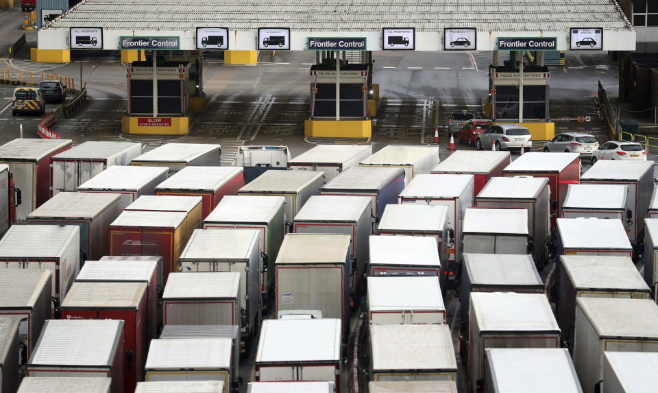 Lorries queue to enter the Port of Dover as the clock ticks down on the chance for the UK to strike a deal before the end of the Brexit transition period on Dec. 31, in Kent, England, Friday, Dec. 18, 2020. (Gareth Fuller/PA via AP)