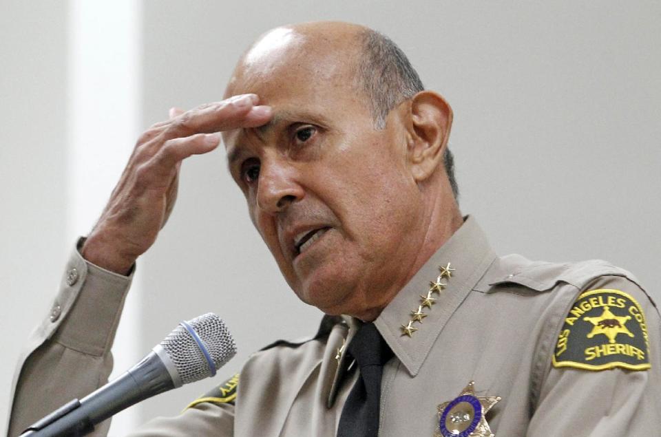 FILE - In this Oct. 3, 2012, file photo, Los Angeles County Sheriff Lee Baca, speaks in Los Angeles. A federal judge has declared a mistrial in the corruption trial of former Los Angeles County Sheriff Baca after jurors said they were hopelessly deadlocked. The judge made the decision Thursday, Dec. 22, 2016, as the jury was in its third day of deliberations. (AP Photo/Reed Saxon, File)