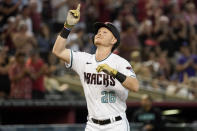 Arizona Diamondbacks' Pavin Smith points skyward after a three-run home run against the Colorado Rockies during the second inning of a baseball game Monday, May 29, 2023, in Phoenix. (AP Photo/Darryl Webb)