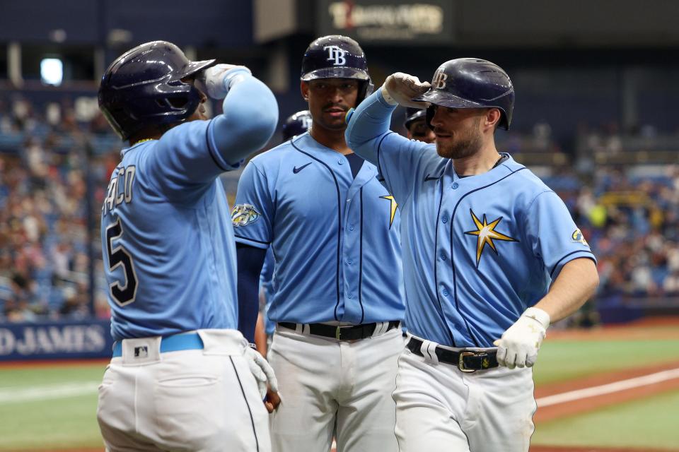 Brandon Lowe celebrates his grand slam on Sunday with Wander Franco.