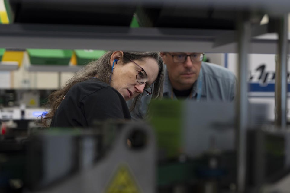 Election workers watch as vote-by-mail ballots are sorted during primary voting at the Multnomah County elections office on Tuesday, May 21, 2024, in Portland, Ore. (AP Photo/Jenny Kane)