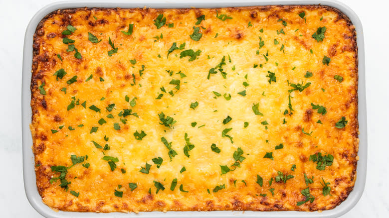 Cheesy lentil moussaka in baking dish