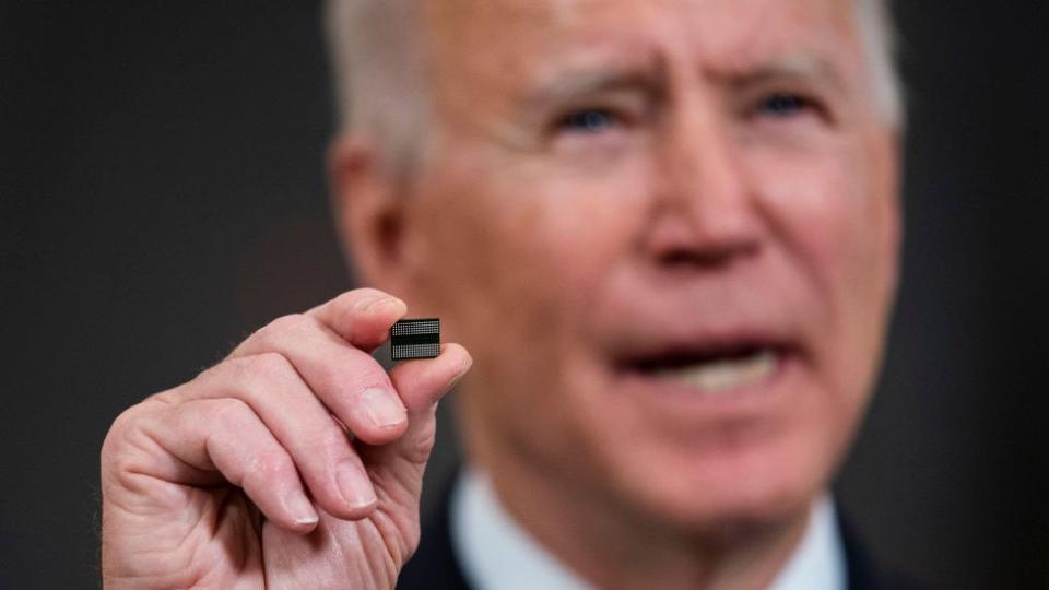 President Biden holds chip