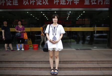 Chen Xuejun, who was born in 1987, poses for a photograph in Shanghai August 30, 2014. REUTERS/Carlos Barria