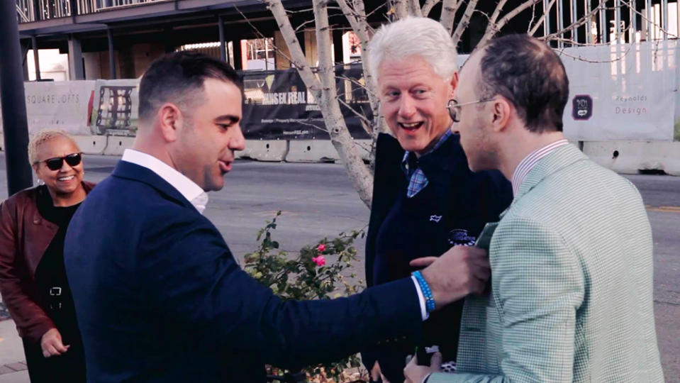 Nimrod Kamer speaking with former president Bill Clinton