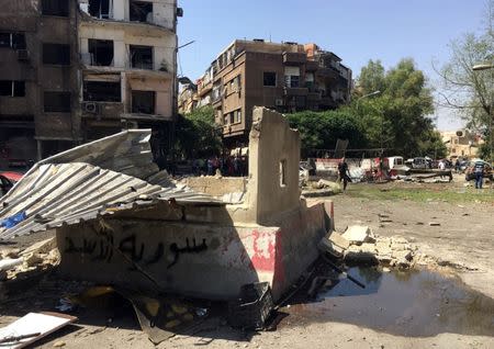 A general view shows the damage at the site of a suicide attack in Tahrir Square, in central Damascus, Syria July 2, 2017. REUTERS/Firas Makdesi