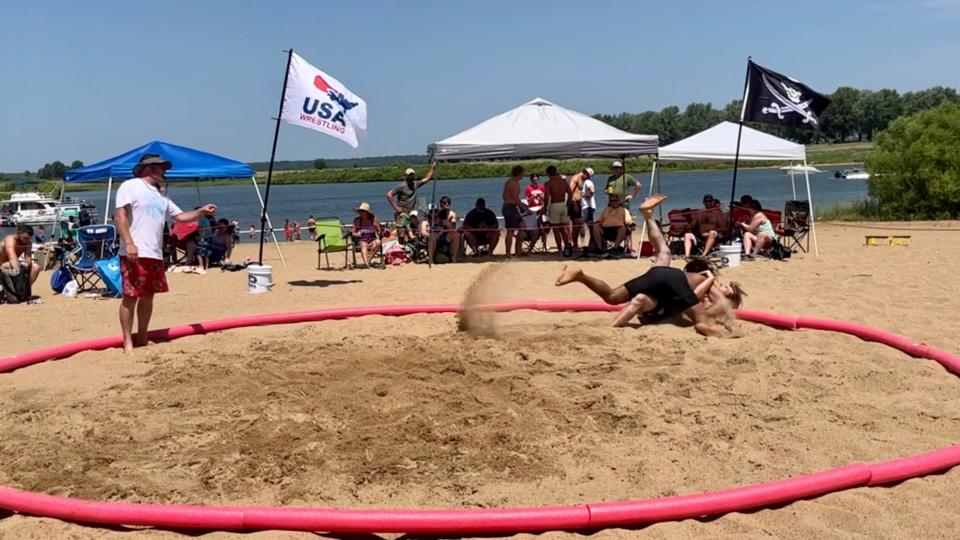 DeMichael Franklin scored a 3-point takedown during the Kraken Beach Wrestling Championships at Rathbun Lake on Saturday. Beach Wrestling is growing in popularity both in the United States and around the world.