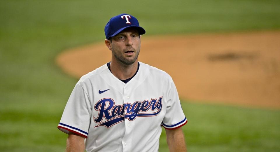 Texas Rangers starting pitcher Max Scherzer (31) walks off the field after he pitches against the Chicago White Sox during the first inning at Globe Life Field.