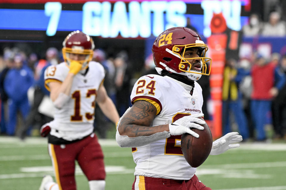 Washington Football Team running back Antonio Gibson (24) scores a touchdown against the New York Giants during the fourth quarter of an NFL football game, Saturday, Jan. 9, 2021, in East Rutherford, N.J. (AP Photo/Bill Kostroun)