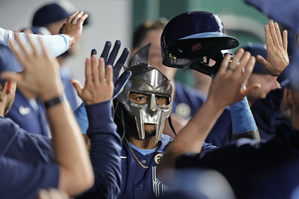 Kansas City Royals' Nelson Velazquez celebrates in the dugout after hitting a solo home run during the fourth inning of a baseball game against the Houston Astros Friday, Sept. 15, 2023, in Kansas City, Mo. (AP Photo/Charlie Riedel)
