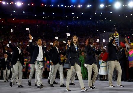 2016 Rio Olympics - Opening Ceremony - Maracana - Rio de Janeiro, Brazil - 05/08/2016. The Refugee Olympic Athletes' team arrives for the opening ceremony. REUTERS/Kai Pfaffenbach