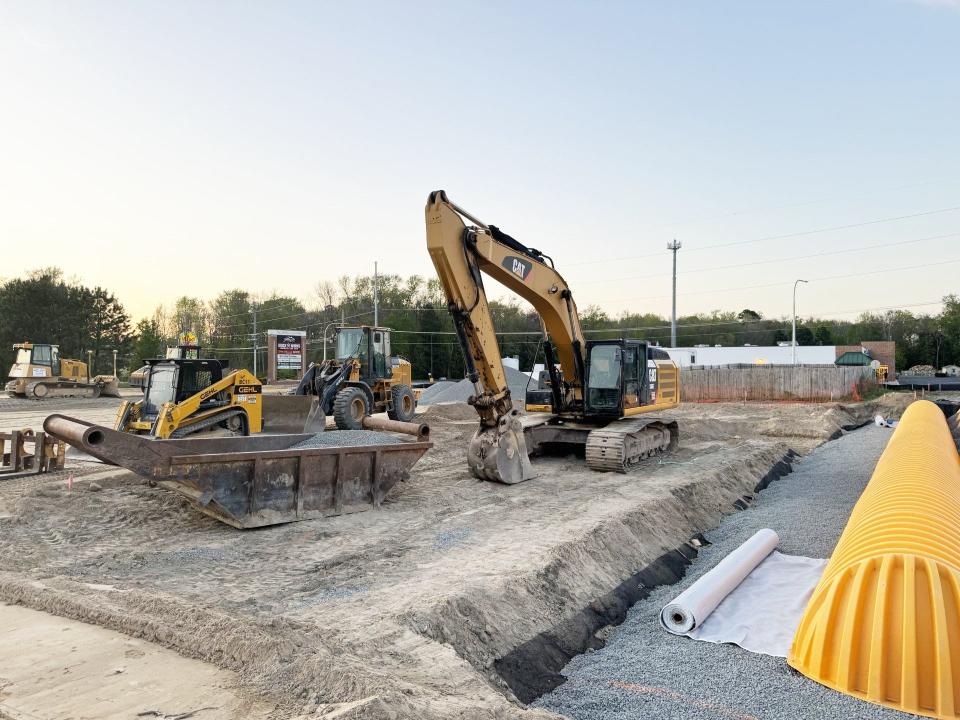 The Community Bank construction site at the southwest corner of Route 24 and Indian Mission Road in Long Neck Saturday, April 20. The graveyard is visible in the background, surrounded by a fence.