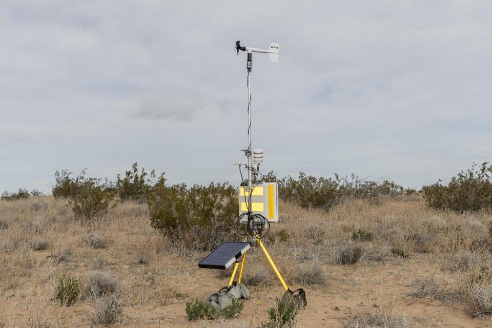 microphones and wind gauges attached to solar panels in the desert