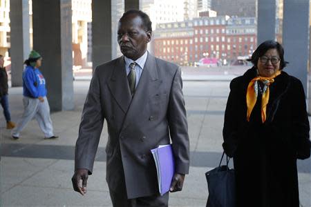 Onyango Obama, the uncle of U.S. President Barack Obama, arrives for a hearing at a federal immigration court in Boston, Massachusetts, December 3, 2013. REUTERS/Brian Snyder