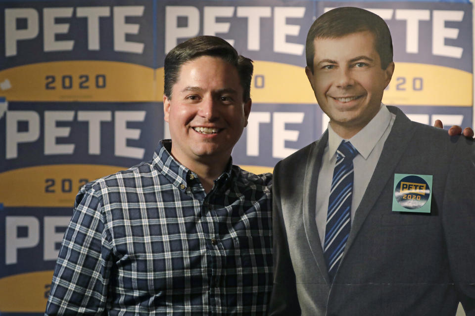 In this Tuesday, Feb. 25, 2020, photo, Taylor West poses for a photograph during a "Republicans in Utah supporting Pete Buttigieg" debate watch party in Salt Lake City. Democratic presidential candidates like to boast about their ability to lure away disaffected Republican voters. If there’s a place to test their skills, it’s Utah. Utah is “not a huge delegate win, but it represents who is a candidate that can realistically peel off some Republican or moderate or independently minded voters to build a coalition,” said West, an executive in the mountain town of Heber City. (AP Photo/Rick Bowmer)