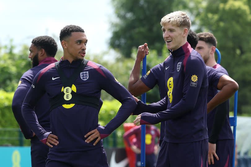 Trent Alexander-Arnold and Anthony Gordon of England look on during a training session at Tottenham Hotspur Training Centre on June 06, 2024 in London, England.