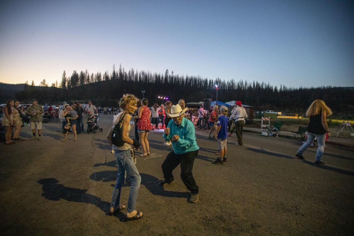 Community members dance in the street during the annual Gold Digger Days celebration in Greenville.