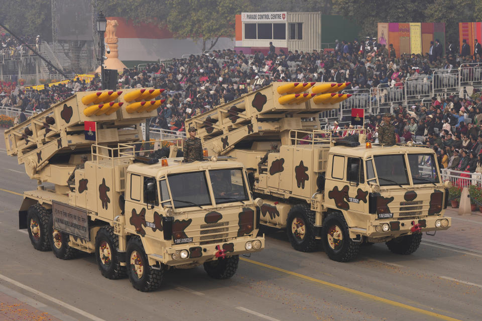 Indian Army multi rocket launcher vehicles drive through the ceremonial Kartavya Path boulevard during India's Republic Day parade celebrations in New Delhi, India, Friday, Jan. 26, 2024. Thousands of people cheer a colorful parade showcasing India's defense capability and cultural heritage braving a winter chill and mist on a ceremonial boulevard in the Indian capital. (AP Photo/Manish Swarup)